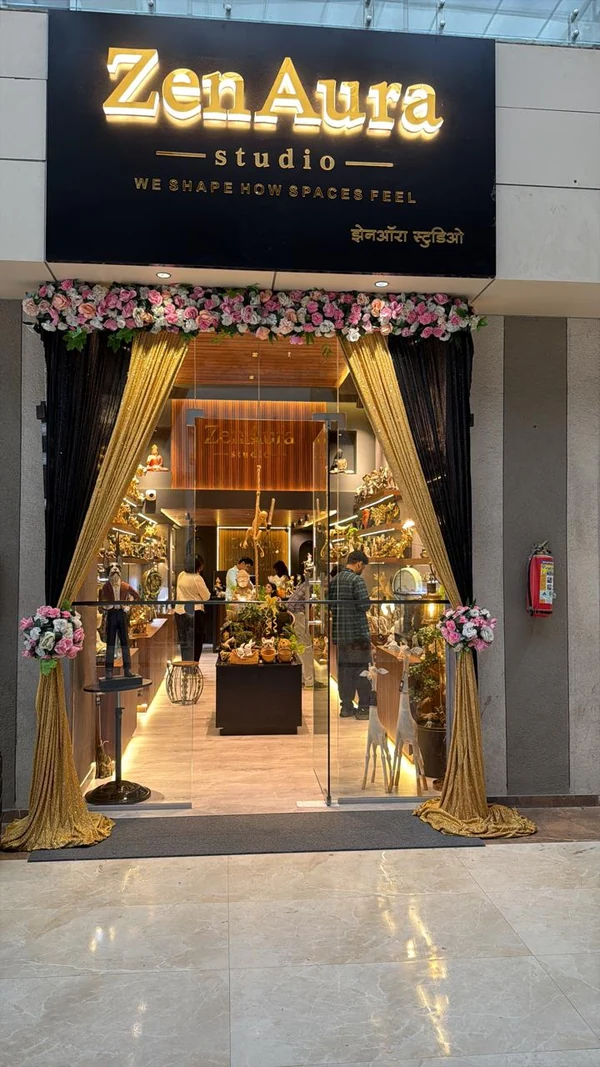 ZenAura Studio entrance with gold curtains and floral decoration